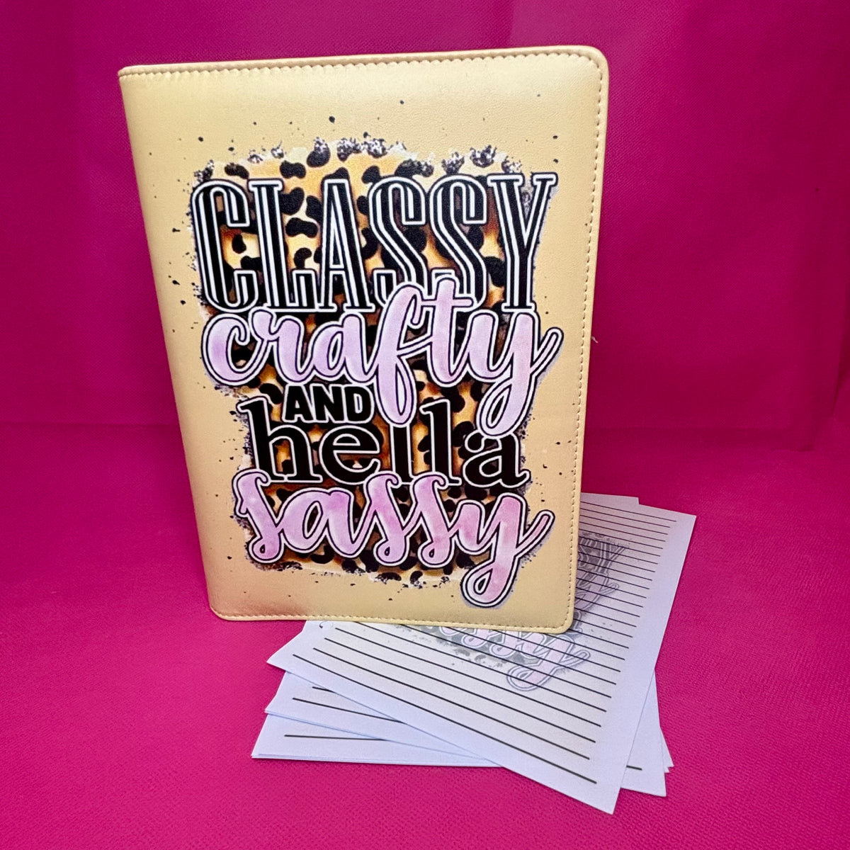 Champagne-gold A5 faux leather binder with 'Classy Crafty and Hella Sassy' typography over a leopard print splash