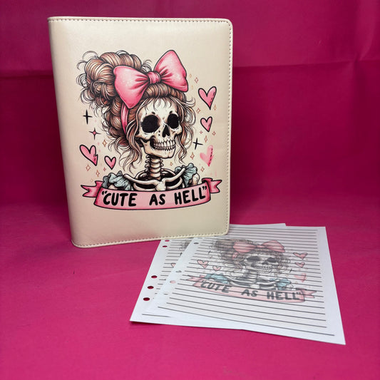 Cream A5 faux leather binder with a cartoon skeleton girl with curly hair and a pink bow, 'CUTE AS HELL' banner below