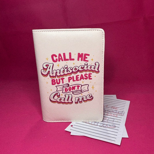 Cream A6 faux leather binder with 'Call Me Antisocial But Please DON'T Call Me' in y2k pink retro drop-shadow lettering with gold stars