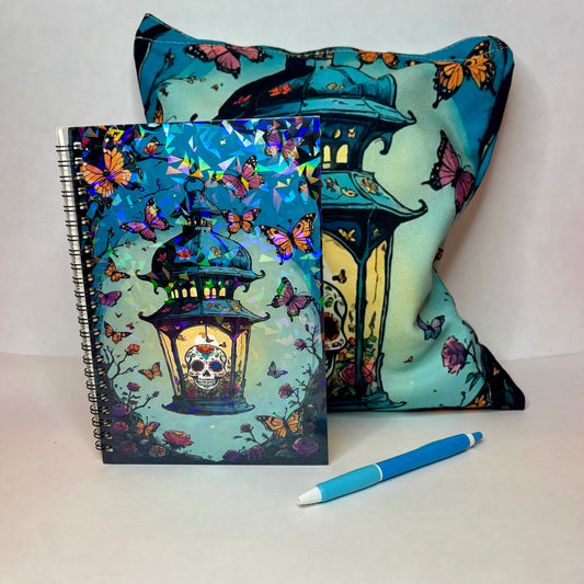 Mini bundle with holographic Skull Lantern notebook featuring a sugar skull in an ornate lantern with butterflies and matching canvas tote