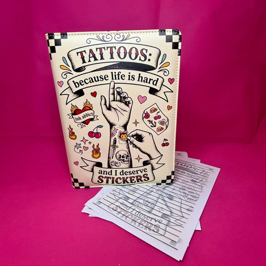 Cream A5 faux leather binder with checkered corners and 'Tattoos: because life is hard and I deserve stickers' in traditional tattoo flash art