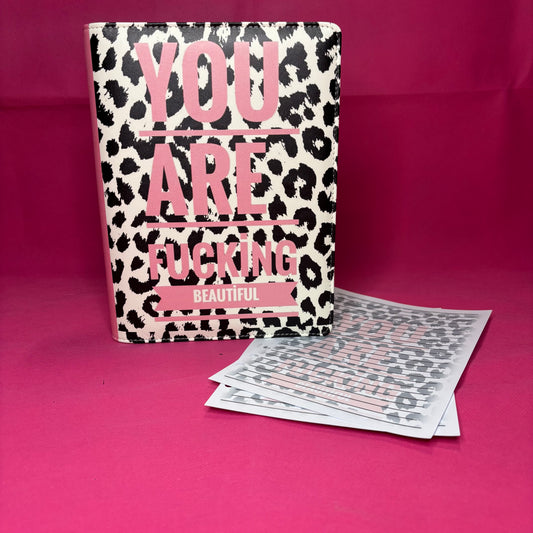 Black and white leopard print A5 faux leather binder with 'YOU ARE FUCKING beautiful' in pink block lettering