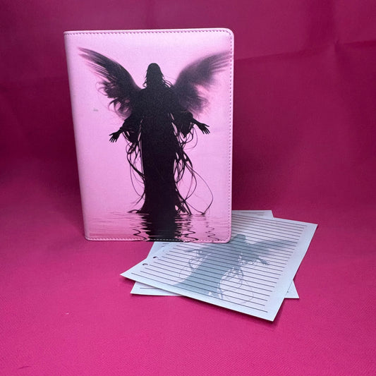 Pink A5 faux leather binder with a black-winged silhouette figure standing in reflective water, hair trailing down