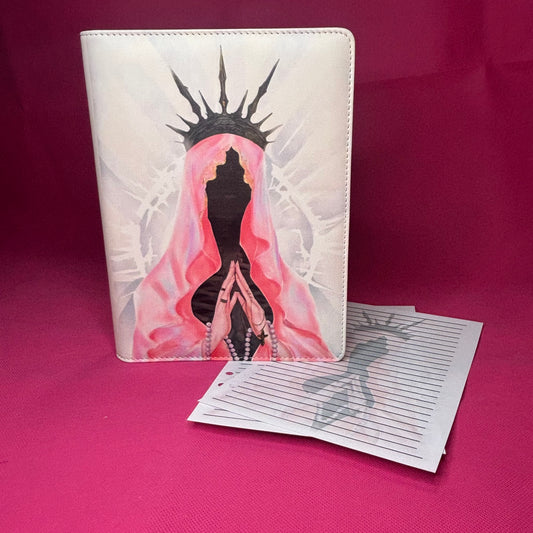 Pearl white A5 faux leather binder with a spike-crowned veiled figure in pink mantle, praying hands with rosary, and a crown of thorns silhouette behind